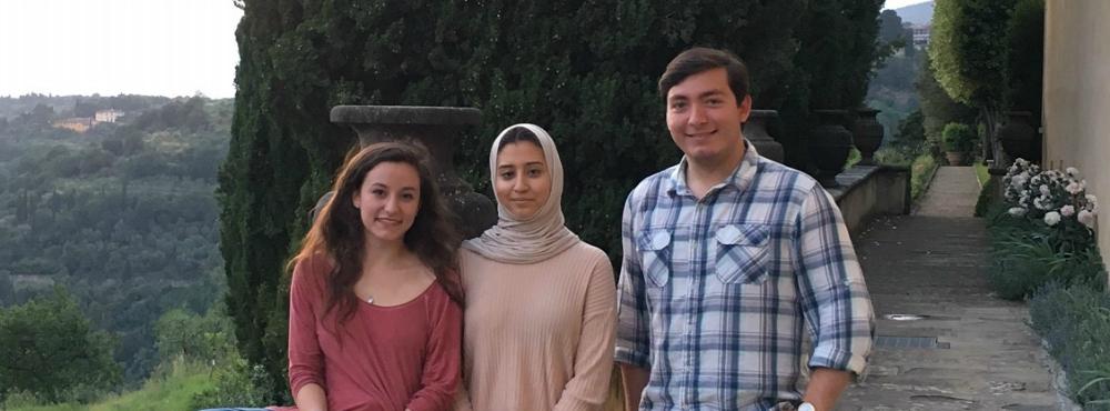 Three summer participants pose on the Villa's veranda.